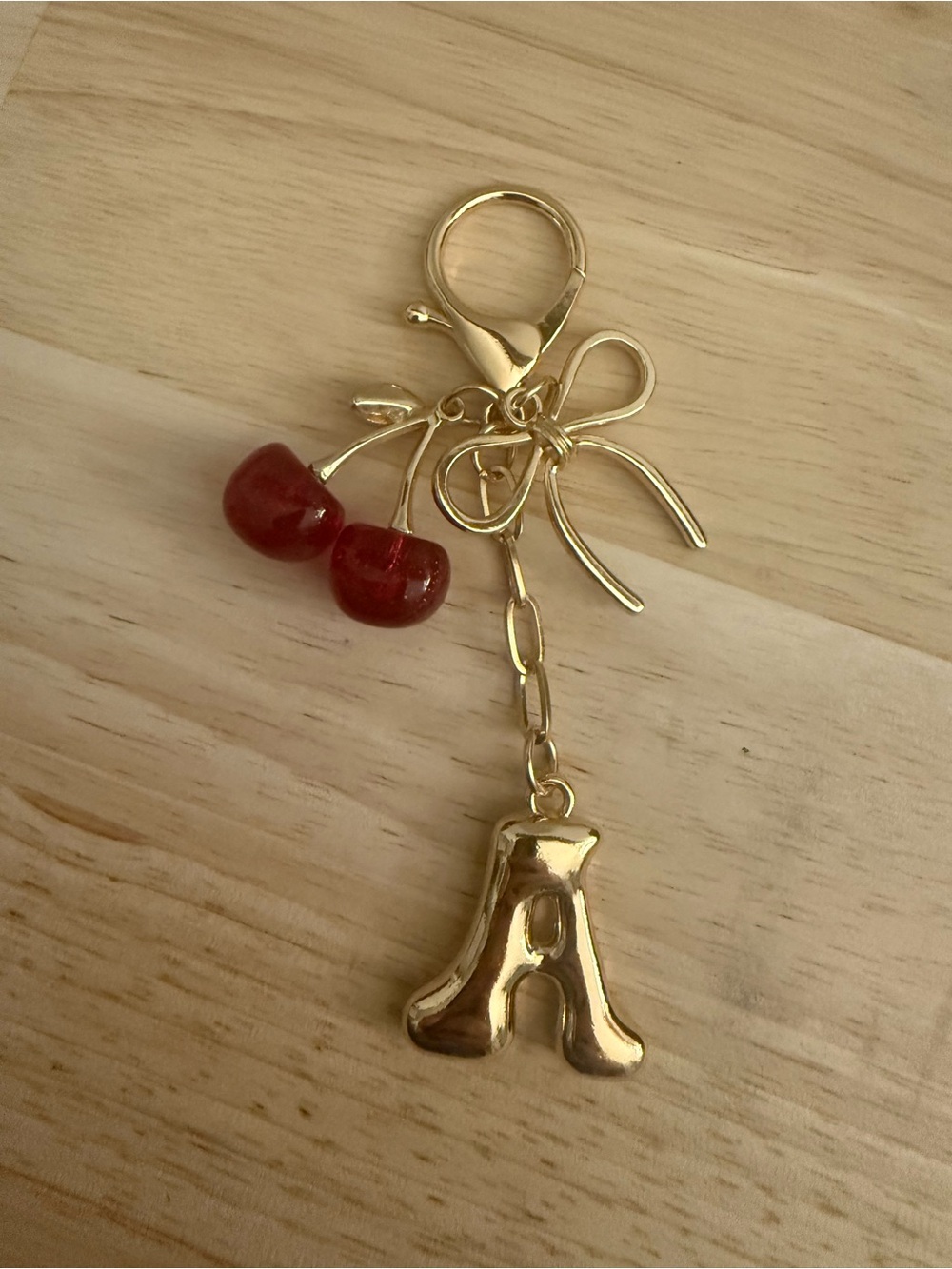 Gold Initial 'A' Charm Keychain with Red Cherry Accent